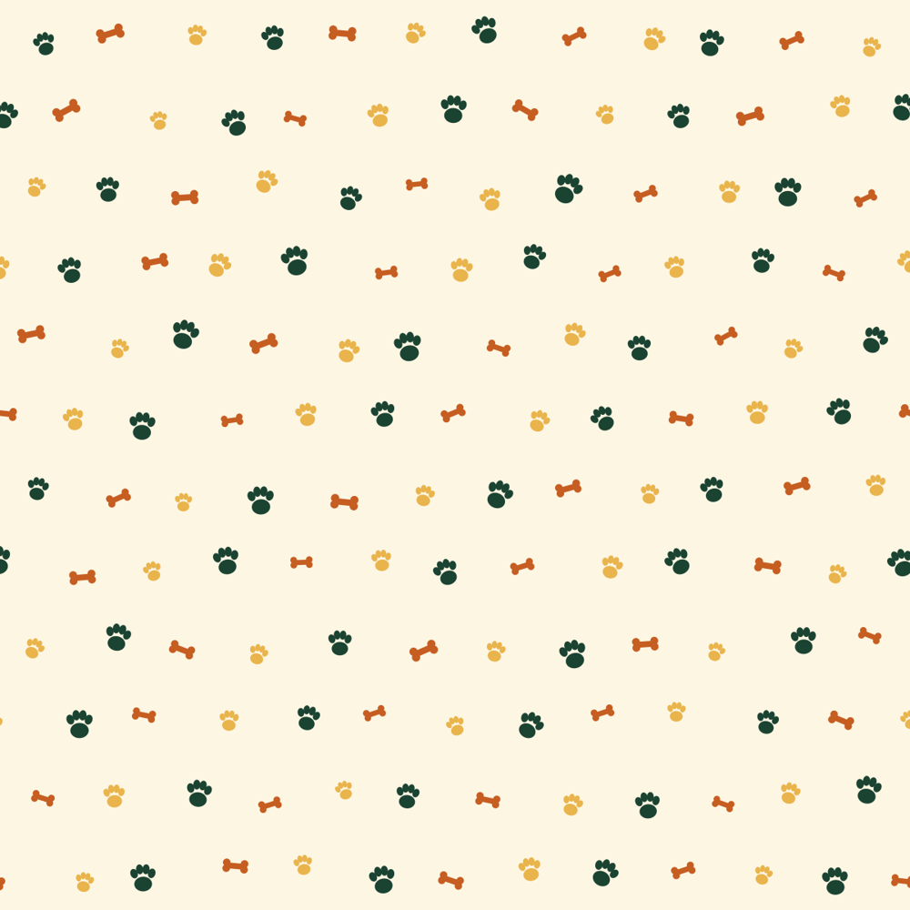 Dog bandana with hand-drawn paw prints and bones in green, terracotta and honey on cream